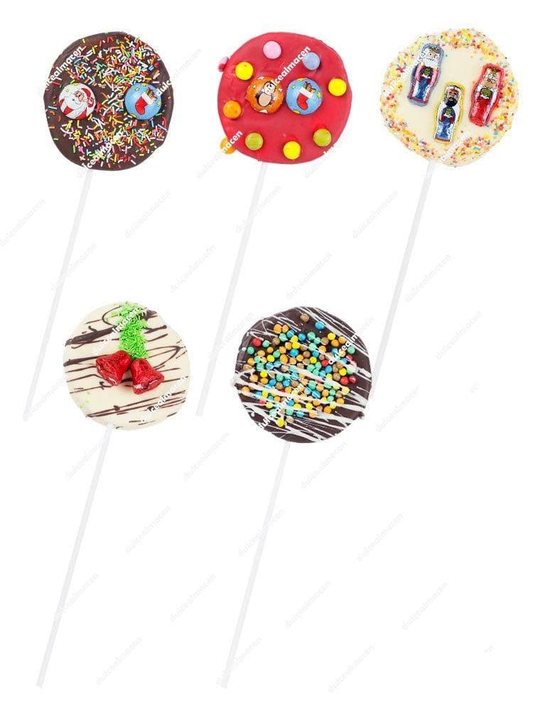 Surtido de piruletas navideñas Choconube con coberturas de chocolate blanco, negro y fresa, decoradas con motivos de campanas, fideos de colores y figuras de Navidad - Dulcealmacen