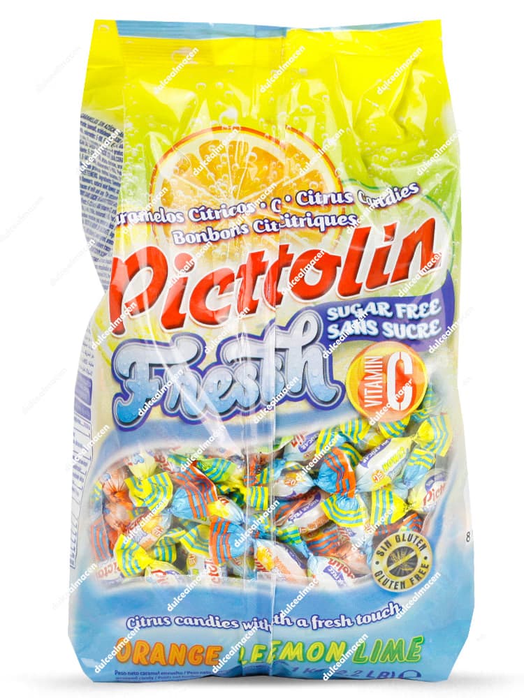 Bolsa vertical de Intervan Pictolin Fresh sin azúcar 1kg mostrando el empaque translúcido y amarillo con caramelos cítricos envueltos individuales de naranja, limón y lima con el sello Sin Gluten y Vitamina C - Dulcealmacen archivos 8413209310252_resultado.avif y 8413209310252x_resultado.avif